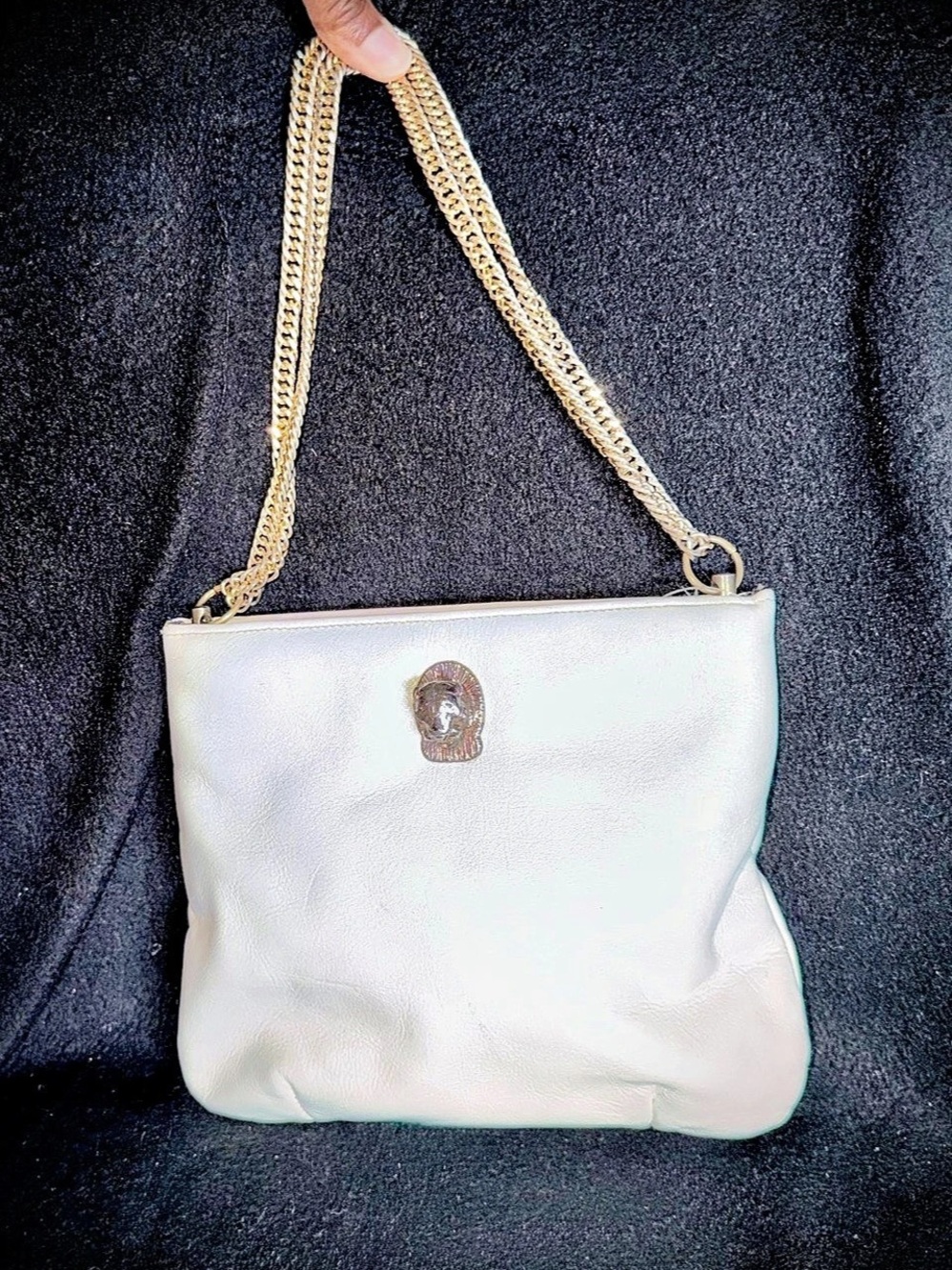 Ruth Saltz leather shoulder bag featuring iconic signature gold cougar head